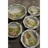 A ROYAL DOULTON FRUIT SET DECORATED WITH HUNTING SCENES CONSISTING OF FOUR SMALLER BOWLS AND A