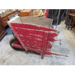 A LARGE VINTAGE WOODEN DEEP WHEEL BARROW A/F