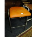 A MODERN ORANGE STOOL TOGETHER WITH A MODERN TAN LEATHER STOOL