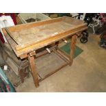 A VINTAGE WOODEN TRESTLE BENCH WITH MANGLE ATTACHMENT ETC