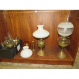 AN ASSORTMENT OF PARAFFIN LAMPS AND ACCESSORIES ETC