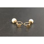 A PAIR OF SCREW BACK CLIP ON PEARL EARRINGS STAMPED 9CT