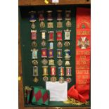 A DISPLAY CASE CONTAINING ROAB SASHES AND MEDALS RELATING TO RETFORD & DISTRICT KNIGHTS CHAPTER