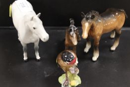A BESWICK GREY PONY FIGURE TOGETHER WITH TWO BESWICK FOALS AND A GOLDFINCH (4)