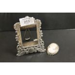 A SILVER PICTURE FRAME TOGETHER WITH A HALLMARKED SILVER CAMEO (2)