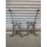A PAIR OF FISHER & SON OF WEST BROMWICH REVERSIBLE RAILWAY PLATFORM CAST METAL BENCH ENDS