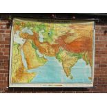 A LARGE ROLLABLE WALL MAP BY GEORGE WESTERMANN SHOWING THE MIDDLE EAST AND INDIA - APPROX 194 X