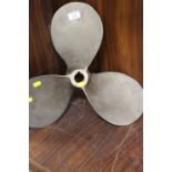 A SMALL BRASS SHIPS PROPELLER