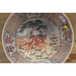 A LARGE ORIENTAL BOWL DECORATED WITH HUNTING SCENES AND SIX FIGURE CHARACTER MARK TO BASE - BADLY