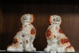 A PAIR OF STAFFORDSHIRE FLAT BACK SPANIELS