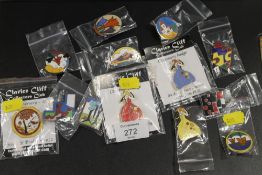 A COLLECTION OF CLARICE CLIFF ENAMEL CLUB BADGES ETC