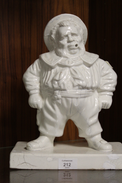 AN UNUSUAL CERAMIC FIGURE OF SAILOR FIGURE WITH SCAPE FOR CLAY PIPE ? A/F