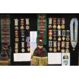 A LARGE DISPLAY CASE CONTAINING ROAB SASHES AND MEDALS RELATING TO RETFORD & DISTRICT 1980 & 1985