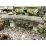 A LARGE CURVED STONE GARDEN BENCH, W 122 cm