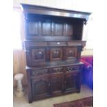 AN ANTIQUE OAK TRIDARN WITH THREE CENTRAL CUPBOARDS, THREE FRIEZE DRAWERS AND CUPBOARDS BELOW, H 198