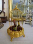 A 20TH CENTURY MUSICAL AUTOMATON WITH TWO BIRDS IN A GILDED CAGE, H 25 cm