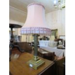 A LARGE AND HEAVY BRASS CORINTHIAN COLUMN TABLE LAMP AND SHADE