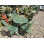 A GREEN PAINTED CIRCULAR GARDEN TABLE AND FOUR CHAIRS