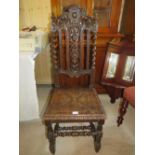 A CARVED OAK JACOBEAN STYLE CHAIR