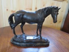 A MODERN BRONZED STUDY OF A STANDING HORSE ON NATURALISTIC BASE, H 22 cm, W 23 cm