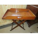 A 19TH CENTURY MAHOGANY BUTLERS TRAY, THE TRAY WITH TWIN HANDLES RAISED ON AN 'X' FRAME STAND