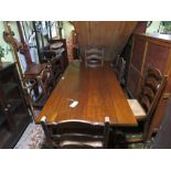 AN OAK REFECTORY STYLE DINING TABLE WITH SIX WICKER SEAT CHAIRS