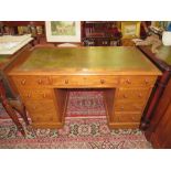 A 19TH CENTURY MAHOGANY TWIN PEDESTAL DESK WITH GREEN LEATHER WRITING SURFACE, WITH AN OF NINE