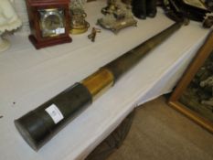 AN ANTIQUE BRASS TWO DRAW TELESCOPE