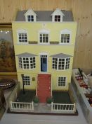 A LARGE 20TH CENTURY PAINTED DOLLS HOUSE IN THE GEORGIAN STYLE, WITH A COLLECTION OF FURNITURE, H 92