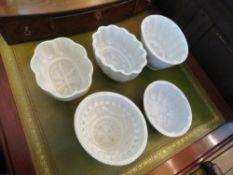 FIVE VINTAGE JELLY MOULDS