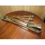 A SET OF 19TH CENTURY BRASS FIRE IRONS AND DOGS