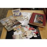 A SMALL QUANTITY OF STAMPS - LOOSE AND IN ALBUMS