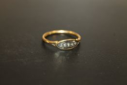 AN 18CT GOLD ILLUSION SET STONES RING WITH