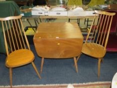 A BLONDE ERCOL DROPLEAF TABLE WITH TWO STICKBACK CHAIRS