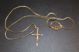 A SMALL CRUCIFIX STAMPED 375 ON A BOX CHAIN STAMPED 9K - APPROX 3.8 G