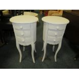 A MODERN PAIR OF WHITE BEDSIDE CABINETS