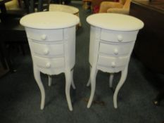 A MODERN PAIR OF WHITE BEDSIDE CABINETS