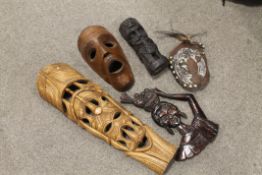 A PAPUA NEW GUINEA CARVED TRIBAL ART SHELL MASK WITH COWRIE SHELLS AND SEEDS, TWO WEST AFRICAN