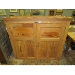 A VINTAGE PINE TWO DOOR BOOKCASE WITH PLAQUE 'ADDISION LTD, WELLINGTON SALOP' H-122 W-138 D-38 CM