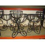 EIGHT WROUGHT IRON FLOWER BASKETS TOGETHER WITH TWO HANGING BASKETS