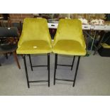 A PAIR OF MODERN MUSTARD UPHOLSTERED KITCHEN STOOLS