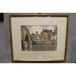 A GILT FRAMED AND GLAZED WATERCOLOUR OF A RIVERSIDE TOWN SCENE ENTITLED 'VIEW ACROSS THE SEVERN -