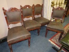 A SET OF FOUR EDWARDIAN CARVED MAHOGANY DINING CHAIRS