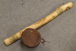 LARGE AUSTRALIAN ABORIGINAL CARVED HARDWOOD DIDGERIDOO AND AN EAST AFRICAN GOAT SKIN DRUM