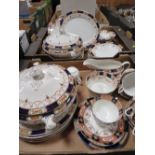 TWO TRAYS OF ANTIQUE BLUE AND GILT CERAMIC TEA AND DINNERWARE