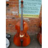 A DOUBLE BASS IN CARRY CASE WITH TWO BOWS