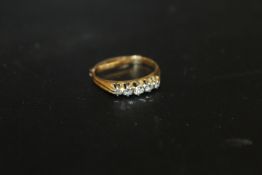 A 9CT FIVE STONE DIAMOND RING - APPROX WEIGHT 2.1 G INCLUDING RING SPACER