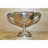 A HALLMARKED SILVER TWIN HANDLED PRESENTATION TROPHY CUP BY A J ZIMMERMAN - BIRMINGHAM 1921 APPROX