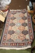 A VINTAGE HAND KNITTED TURKISH RUG