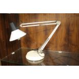 AN ANGLE POISED LAMP